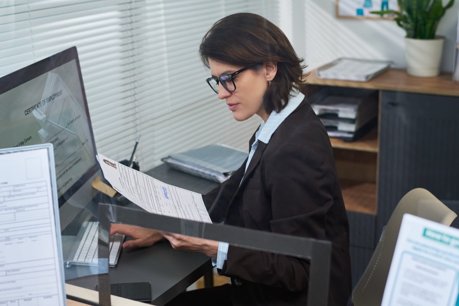 Consultant reviewing police clearance paperwork with a Southern Suburbs client